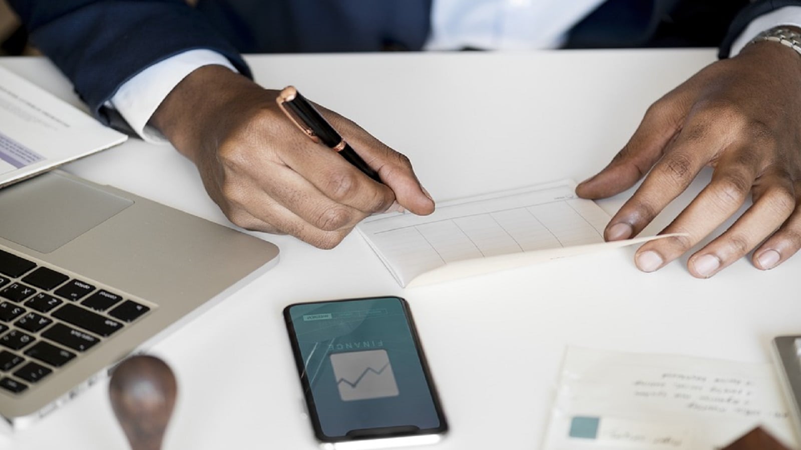 Personal Injury Check. Stock photo of an attorney signing a check. Lewisville Personal Injury Lawyers
