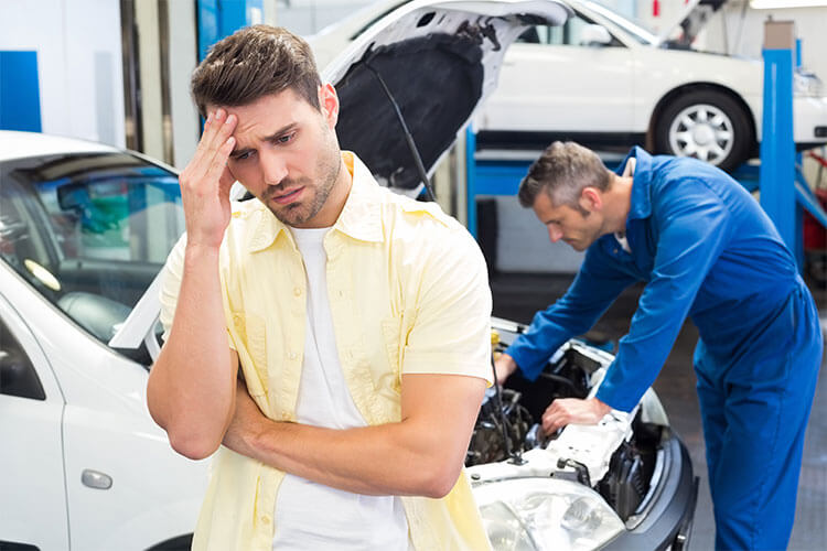 Tips to Maintain a Car That is Rarely Driven 3 Distressed man at vehicle maintenance shop. Tips to Maintain a Car That is Rarely Driven