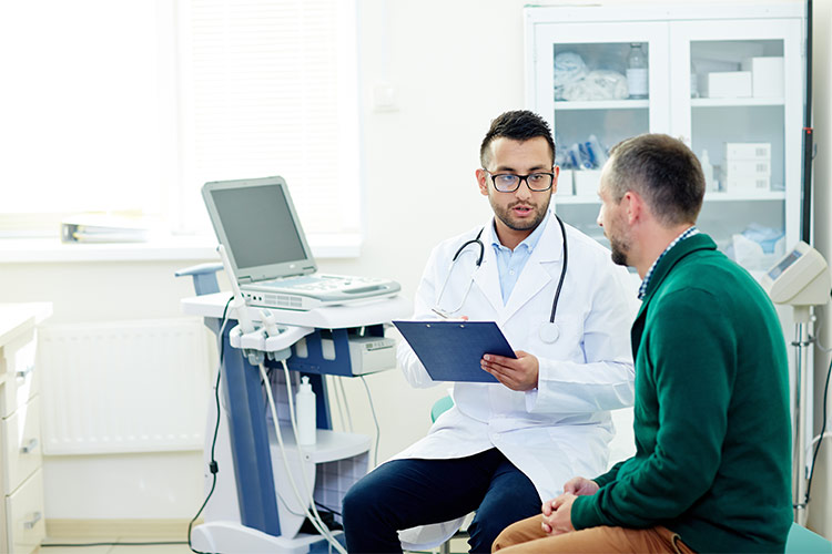 Doctor speaking to a patient - common internal injuries related to car accidents