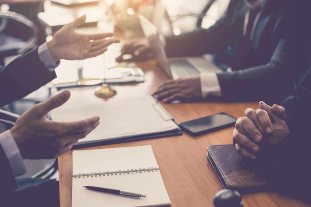 Personal injury lawyers sitting at a table during a deposition in Texas