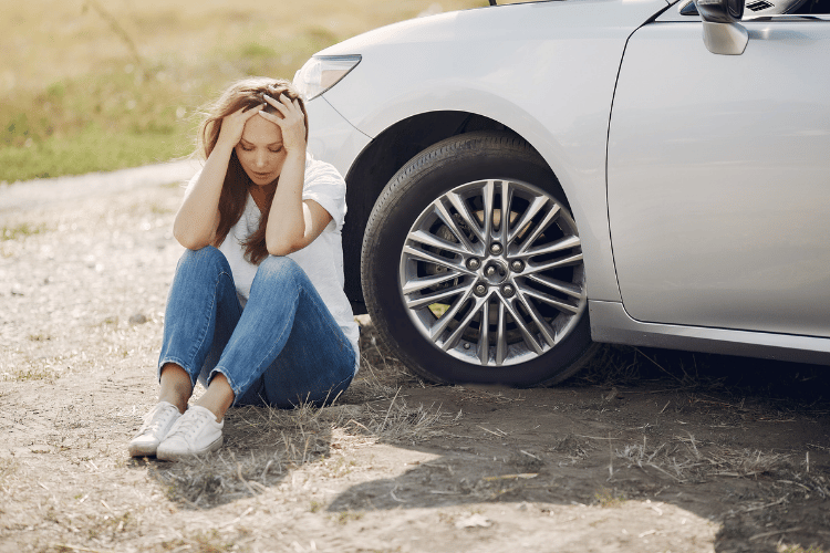 Woman in white shirt needing a nationwide insurance claim lawyer