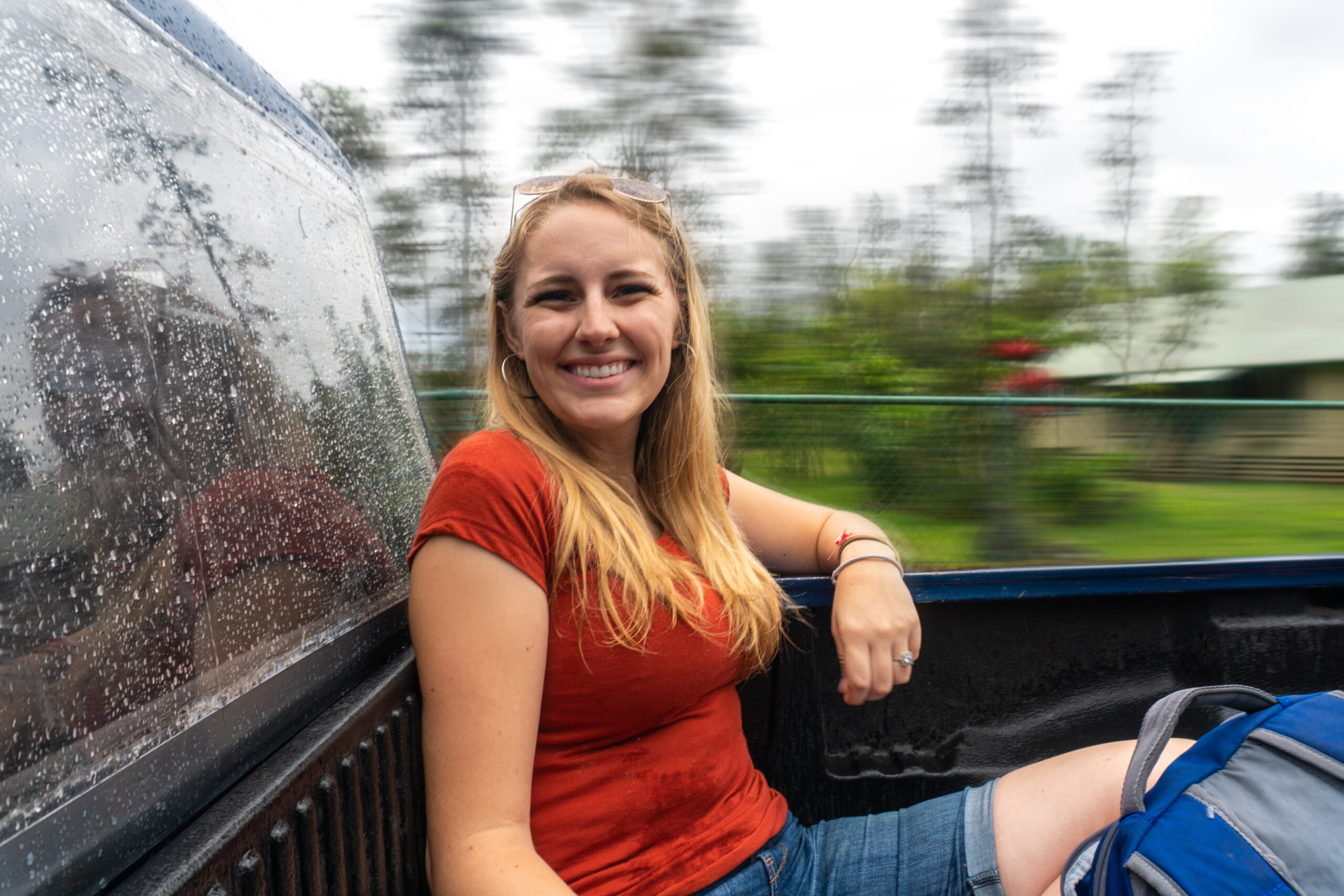 Girl taking a ride in the bed of a truck
