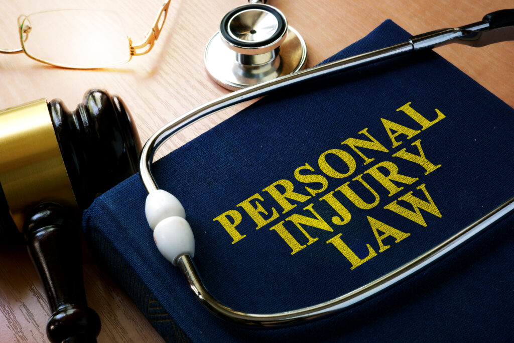 Do Personal Injury Lawyers Handle Medical Malpractice Claims? 2 Personal Injury Law concept. Book and stethoscope. The Difference Between Medical Malpractice and Personal Injury claims