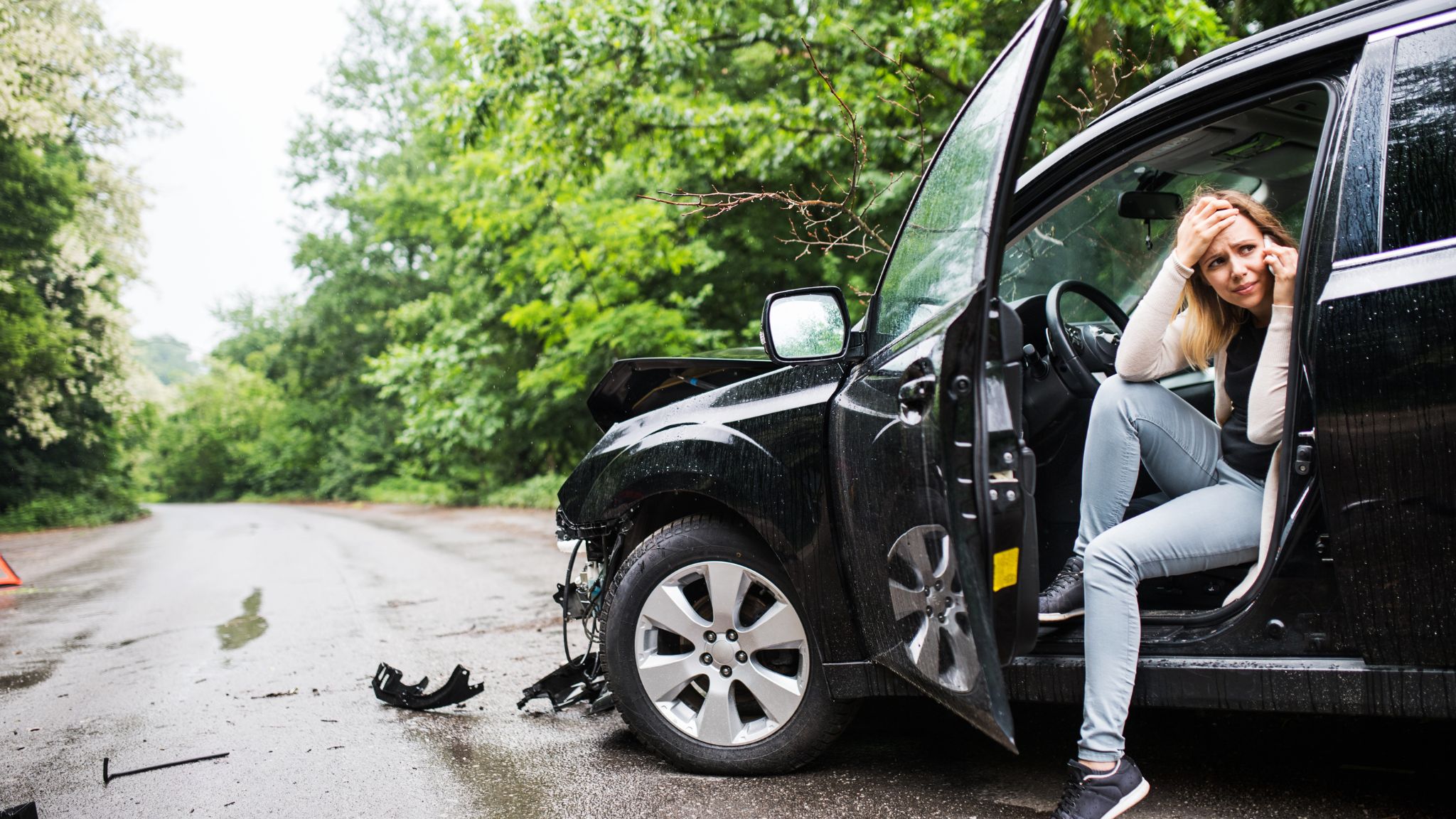 Woman talking on a phone after a car accident. How Is Fault Determined in a Car Accident in Georgia