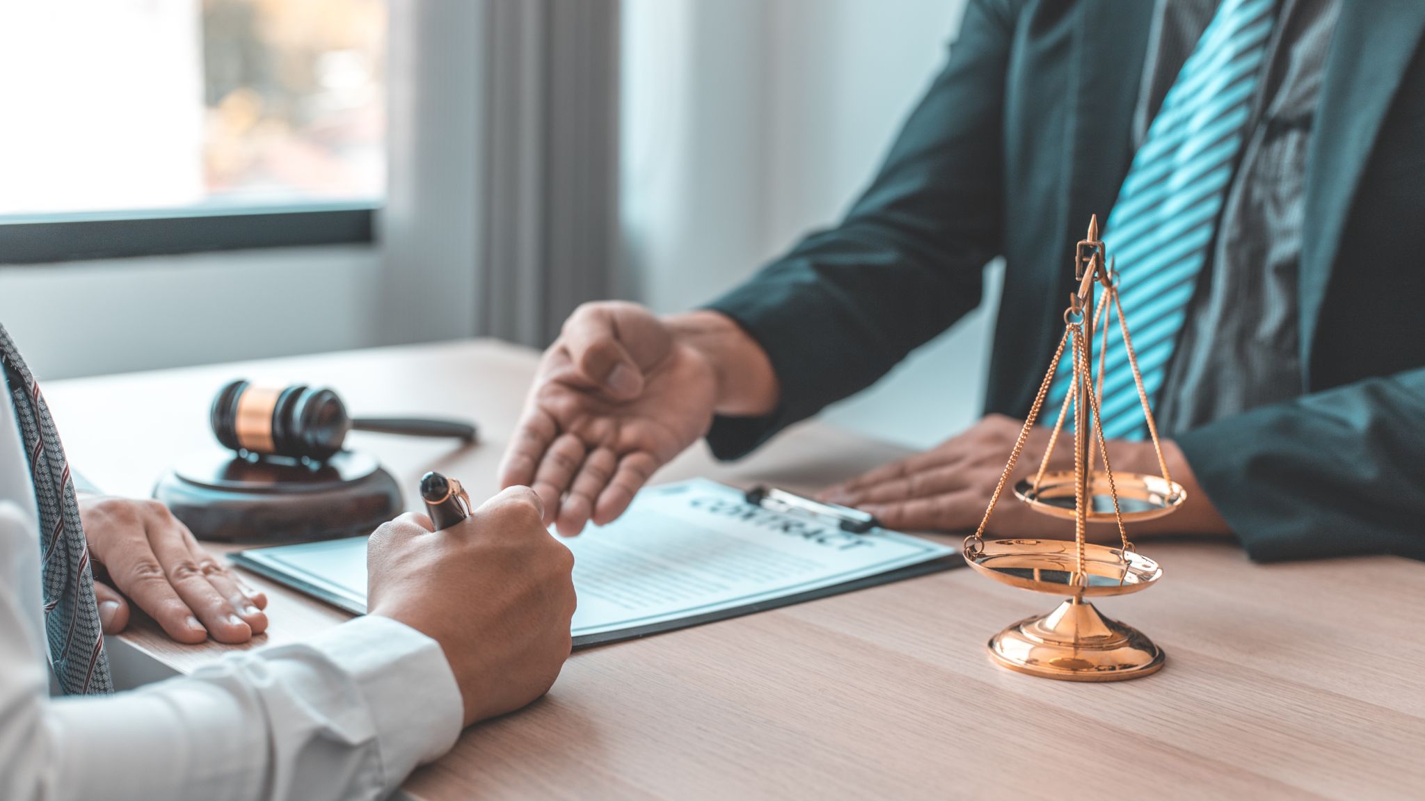 man signing a contract with a lawyer - Texas Accident Laws